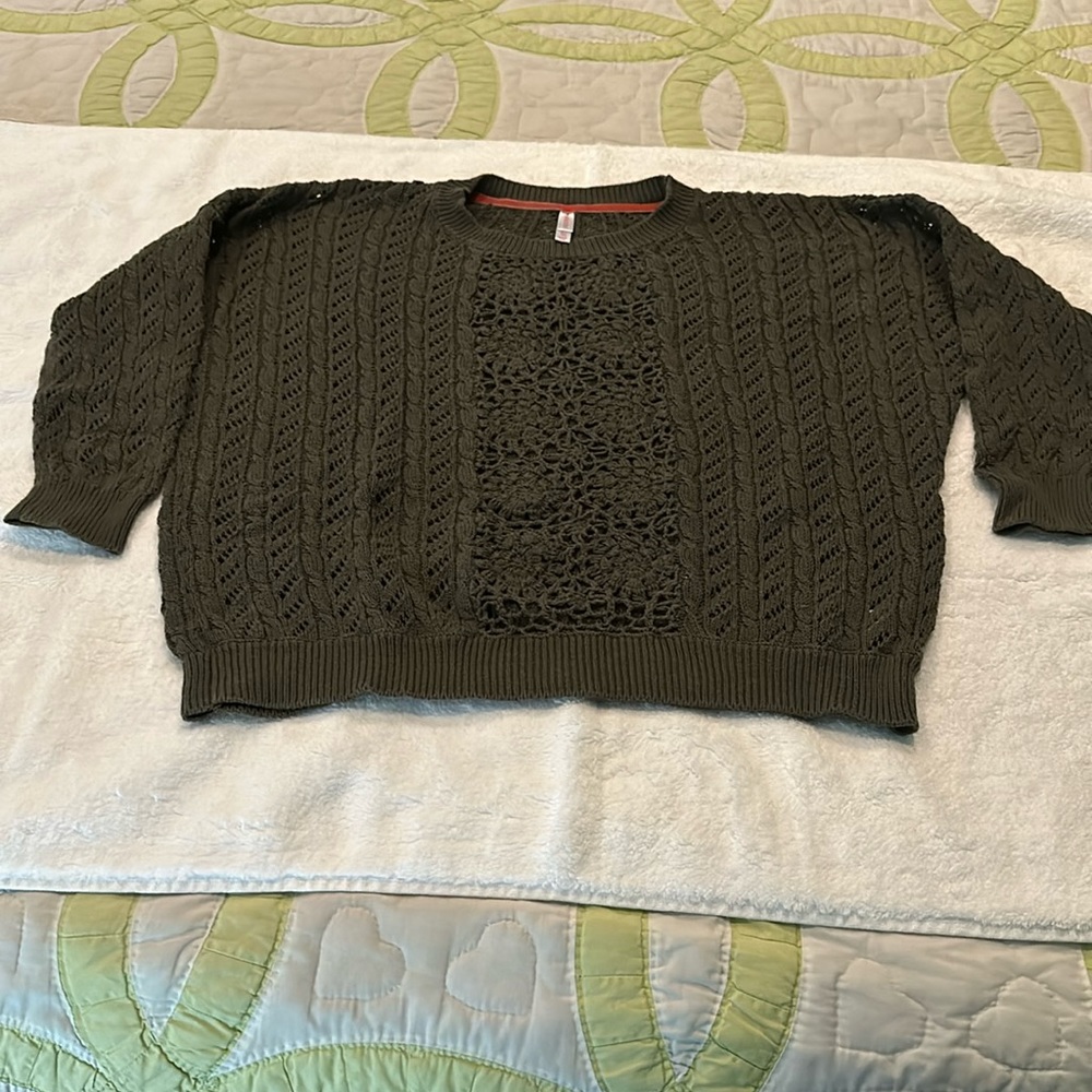 Knit sweater with crochet opening
